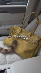 Yellow slouchy shoulder tote video showing the bag and its interior capacity