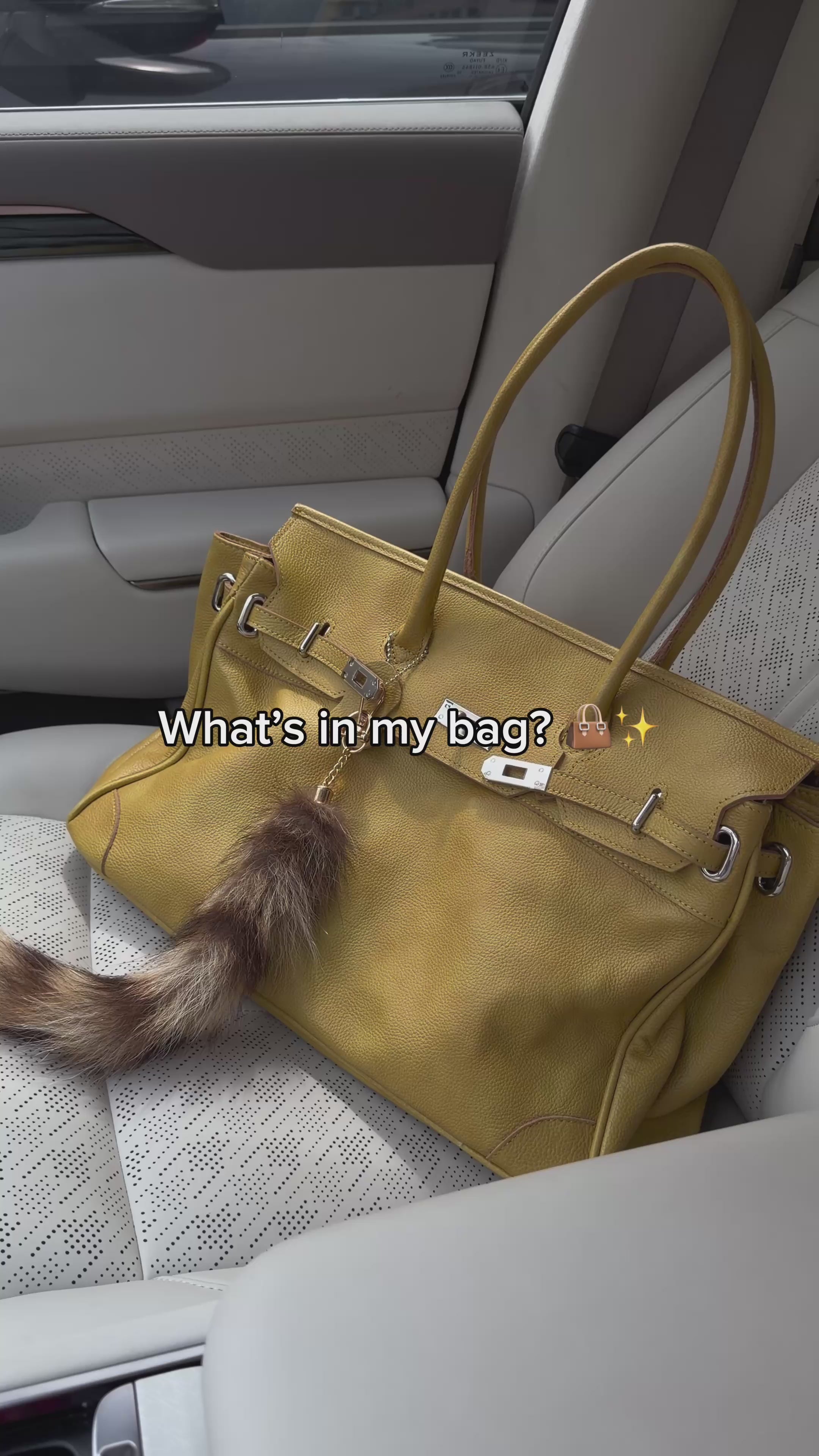 Yellow slouchy shoulder tote video showing the bag and its interior capacity